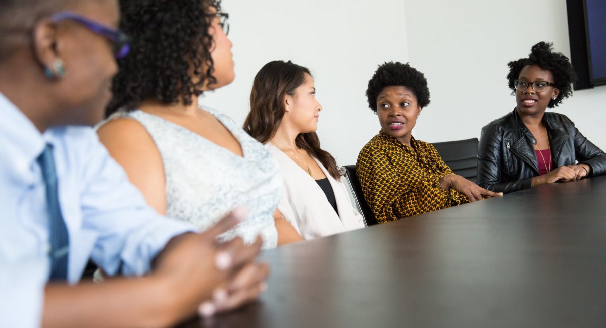 People talking at a conference table