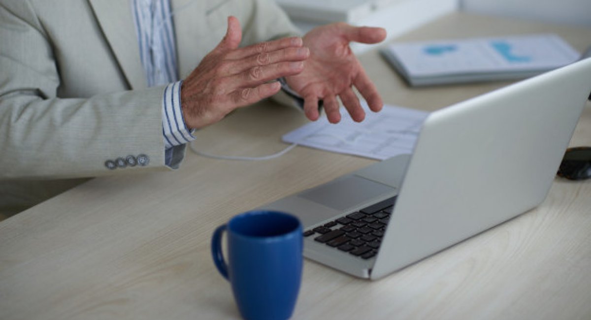 A creative solution! Man's hands clapping in front of a laptop