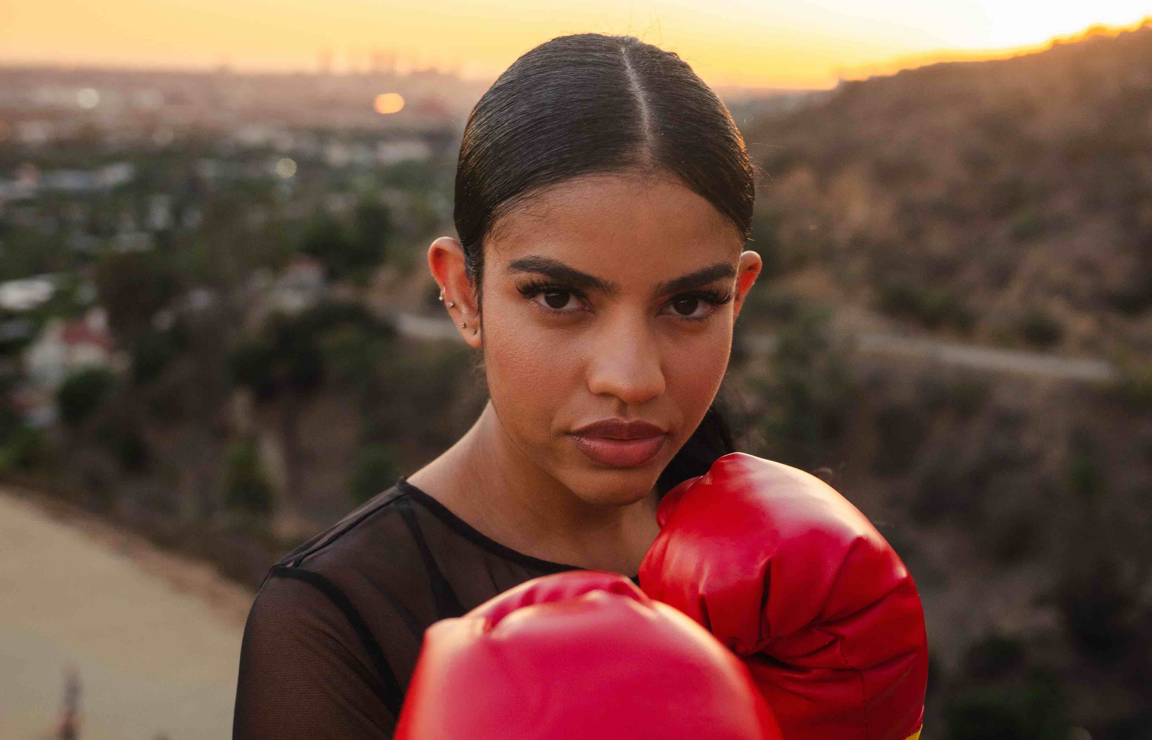 Woman with red boxing gloves