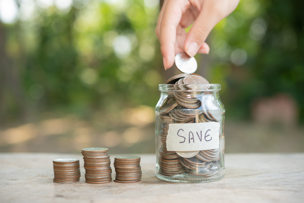 Placing coins in a glass jar