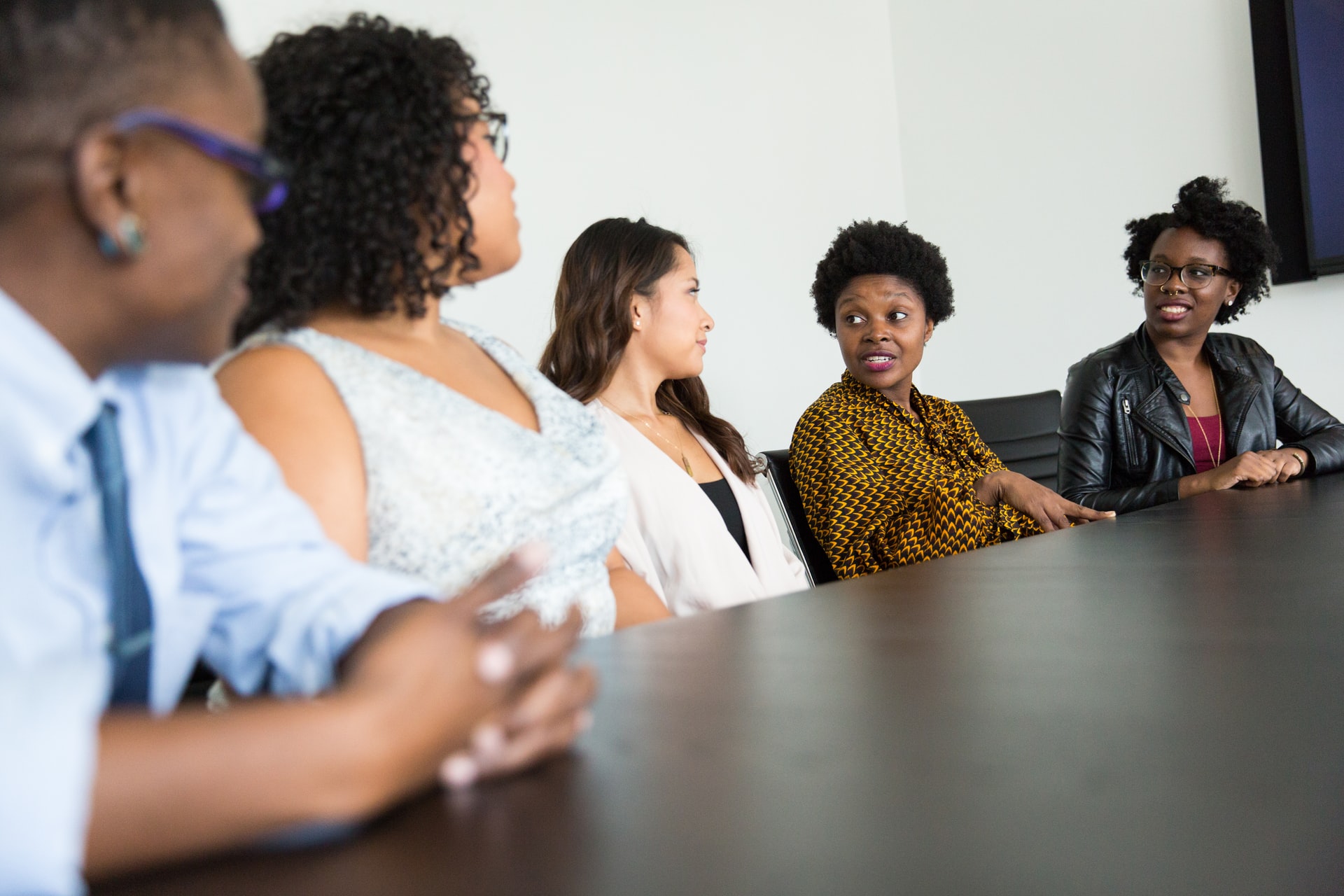 People talking at a conference table