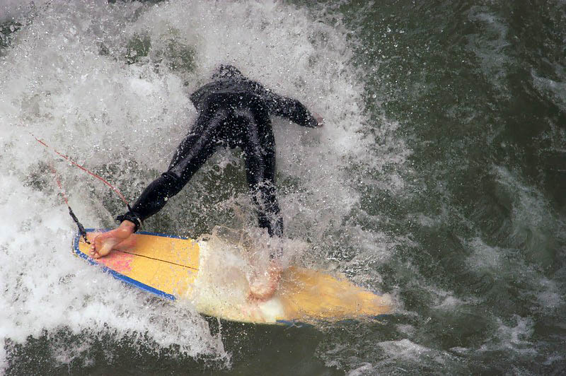 Person wiping out on surfboard