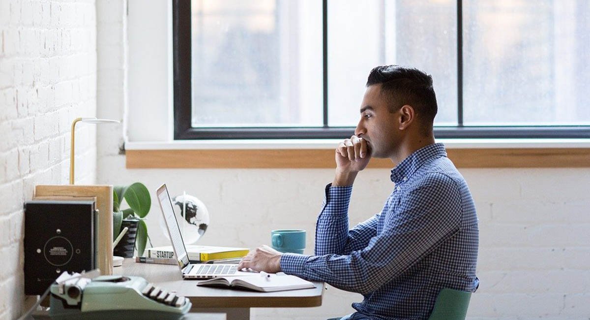 Man at desk with computer