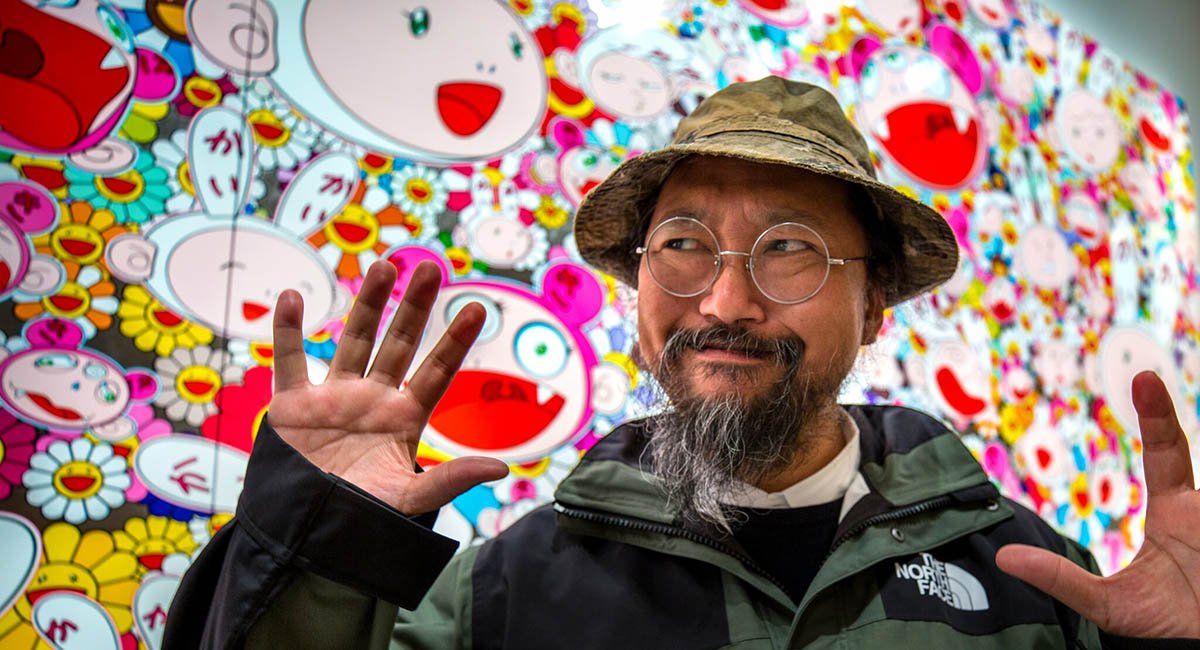 Takashi Murakami in front of his painting