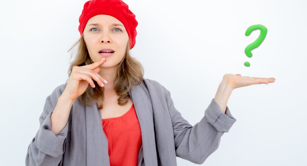 Woman holding a question mark