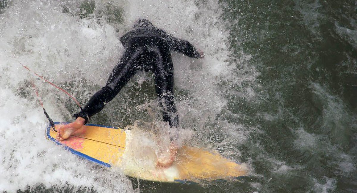 Person wiping out on surfboard