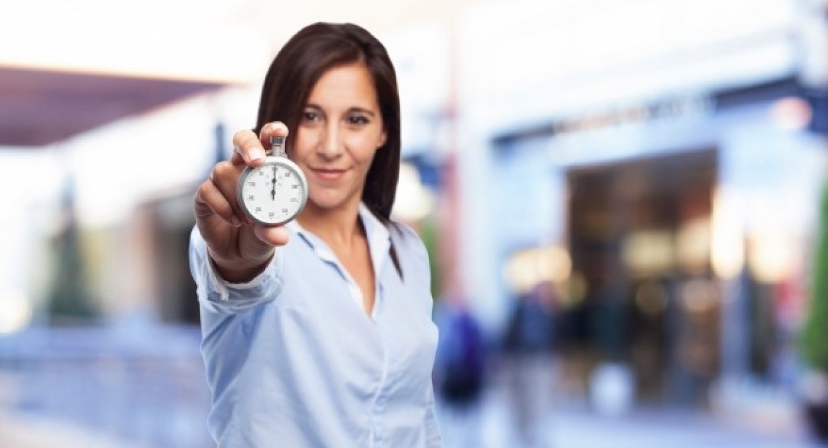 Woman holding a clock